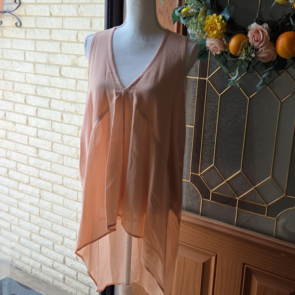 Peach color sleeveless blouse
